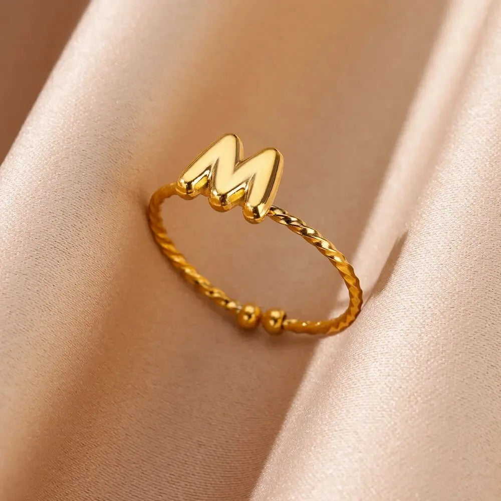 Twisted Initial Letter Ring